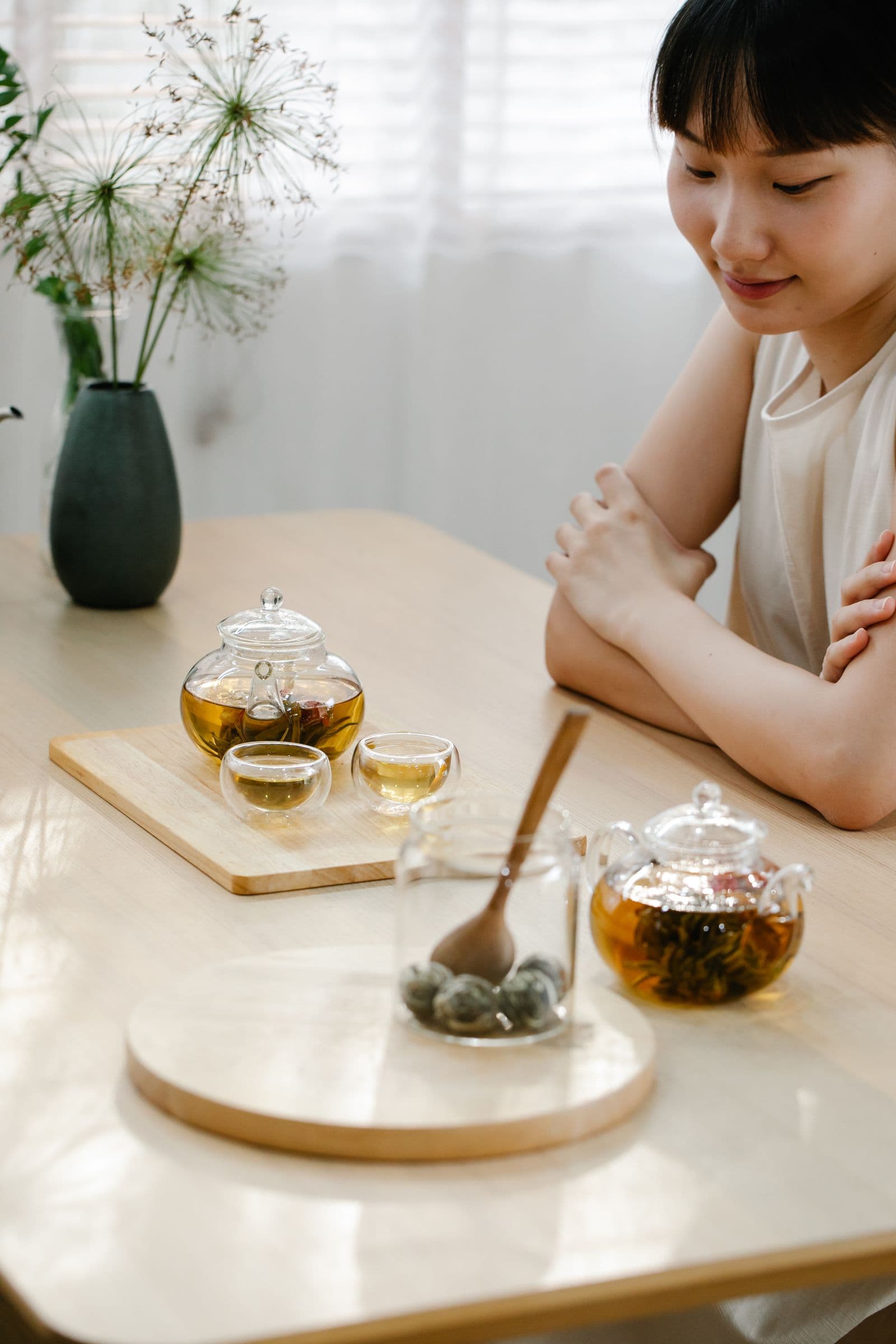 Asian woman enjoying a quiet tea ritual
